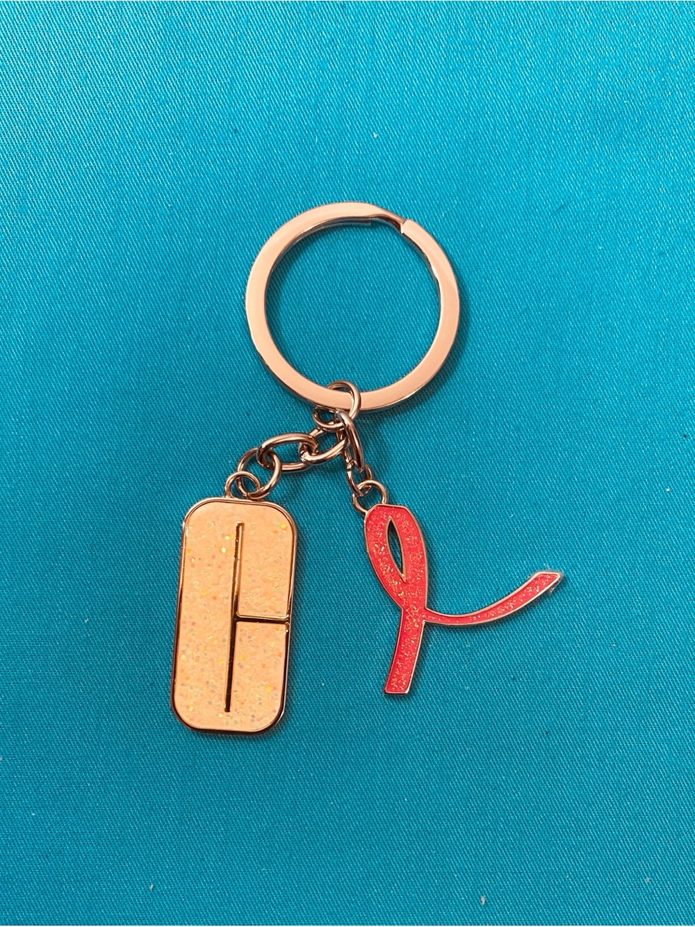 Clinique Rose Gold Keyring with Red Ribbon Charm